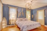 Primary bedroom with a king size bed and ensuite bathroom